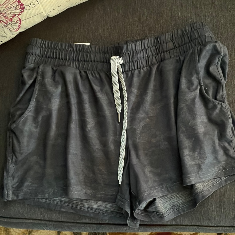 New soft shorts Medium size. Black color with black/white draw string.